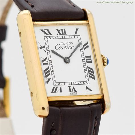 cartier gold plated tank watch.